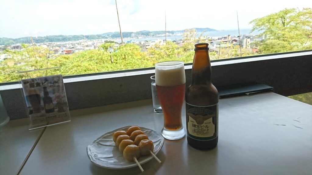 Enjoying beer and dango while overlooking Sagami Bay