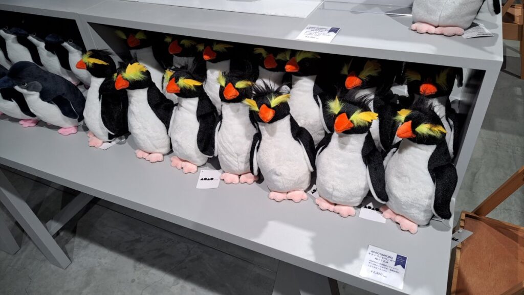 A penguin stuffed animal sold at the souvenir shop.
