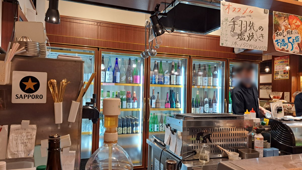 A refrigerator stocked with sake