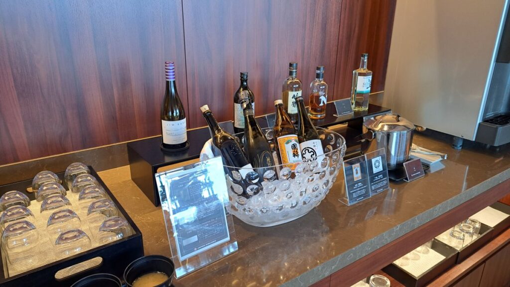 An extensive selection of alcoholic beverages in the Diamond First Class Lounge.