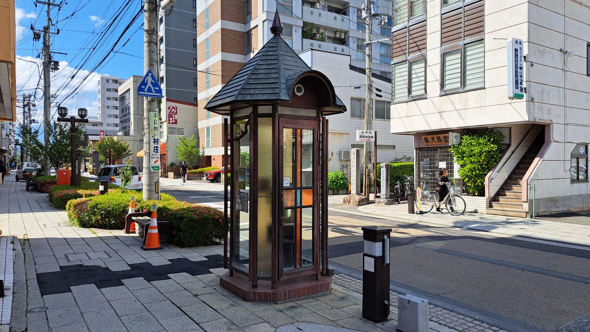 A retro public telephone on Zaimoku-cho Street.