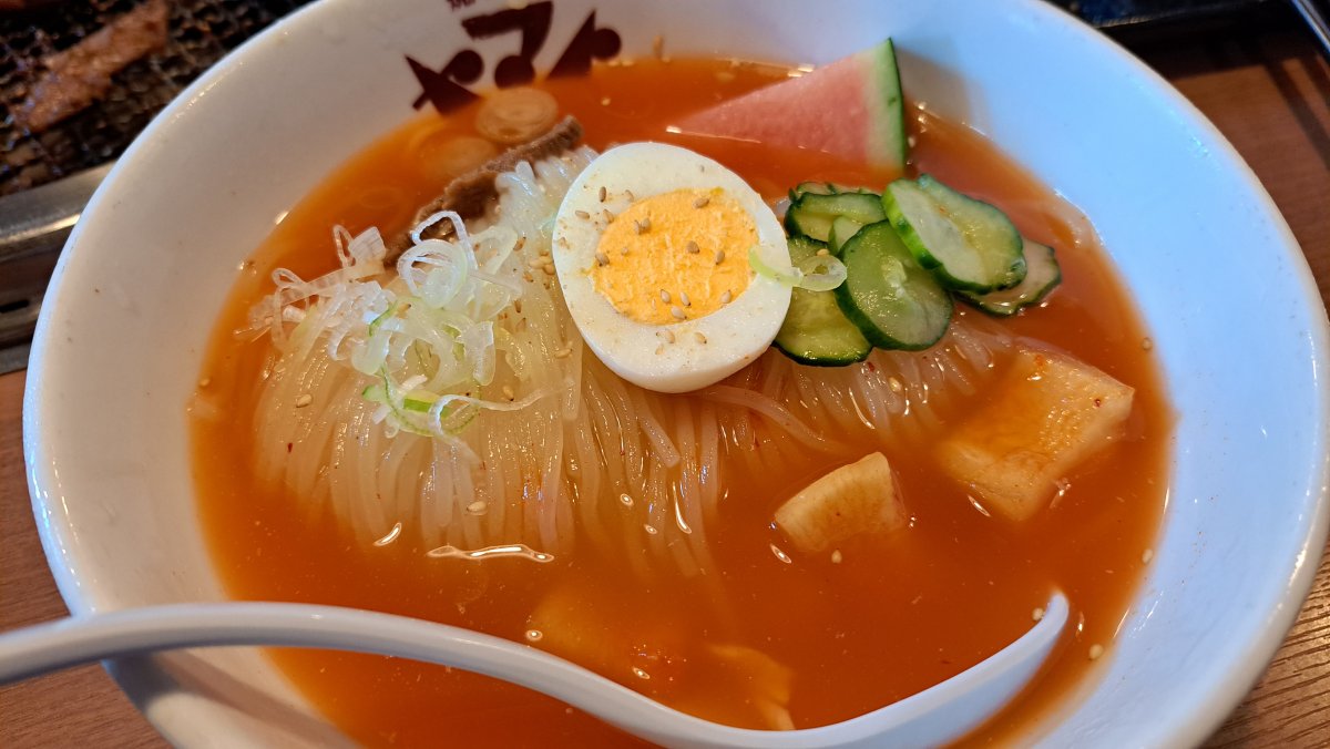 Morioka Cold Noodles featuring exceptionally firm, chewy noodles and a savory, flavorful broth.