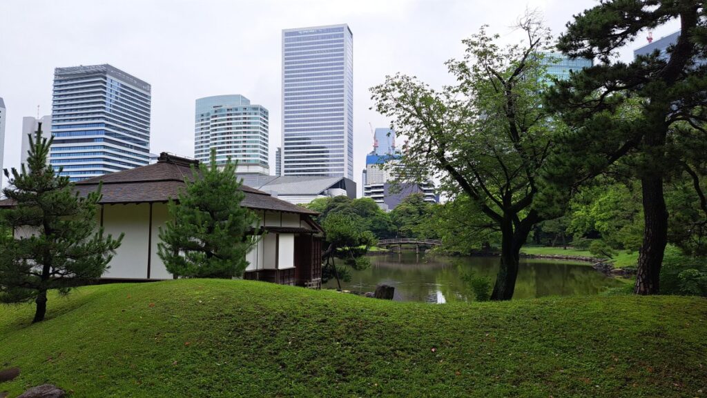 A teahouse visible among the trees.