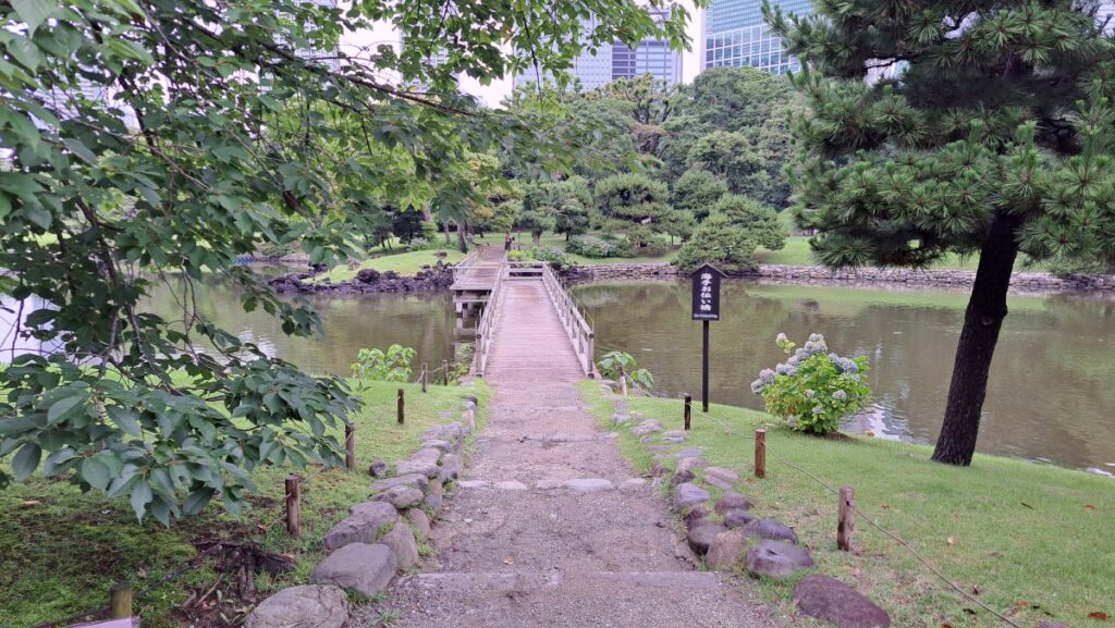 A wooden bridge spanning the pond