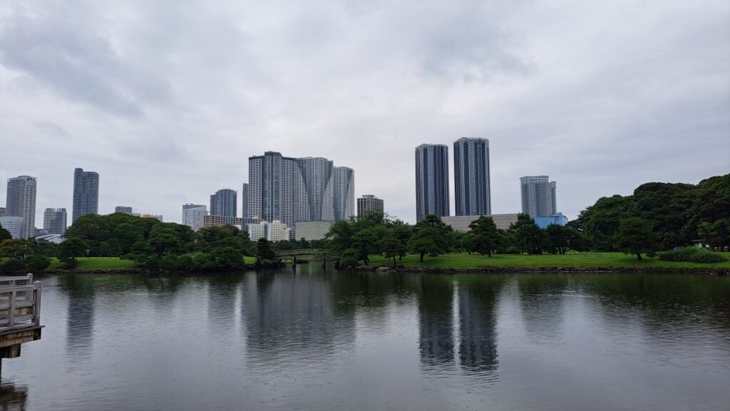 Nakaike Pond and the reflection of buildings on the water's surface.