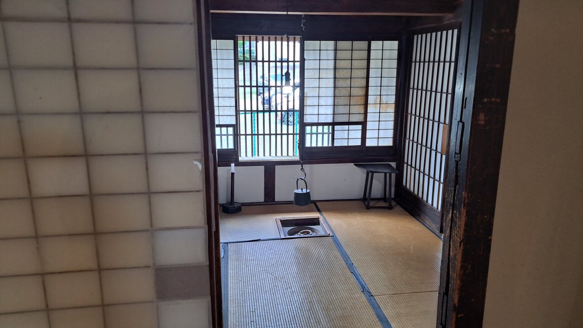 Remnants of a traditional earthen-floored area and a well.
